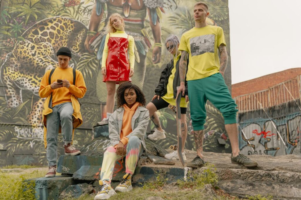 The Art of Drawing Readers In: Your attractive post title goes here Fashionable group of young adults posing stylishly with skateboards against a vibrant street art backdrop.